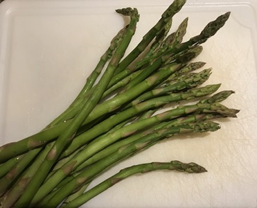 Asparagus on cutting board